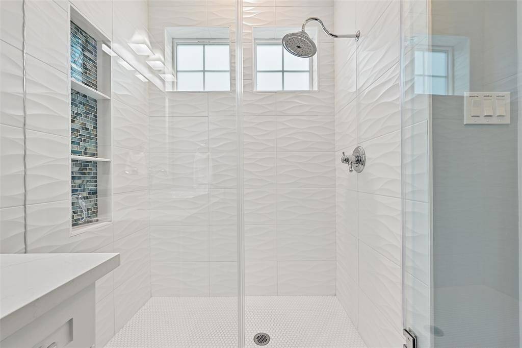 Gorgeous custom floor to ceiling tile makes this shower the best place to freshen up after a good beach day!