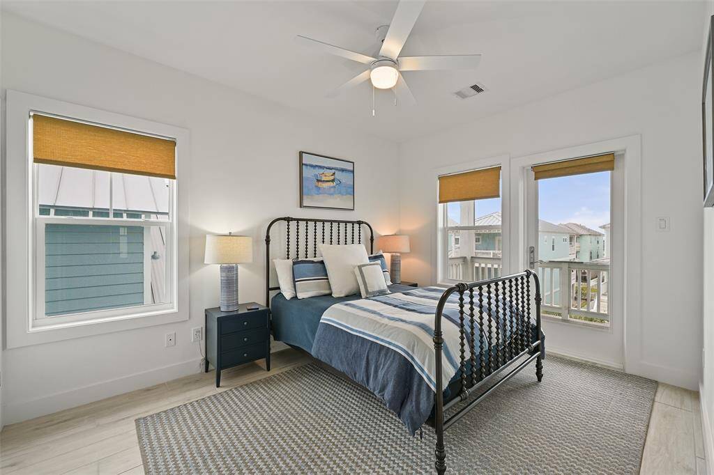 This second floor guest room has an ensuite (with a shared door to the hallway for bunk room) and an exterior door to the upper deck.  Your guests will feel pampered in this gorgeous room.