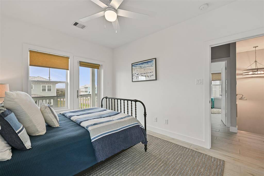 Another view of the upstairs guest room with ensuite. Relax and enjoy the gorgeous island sunsets from your very own top floor haven.  Notice the door that leads to a great deck.