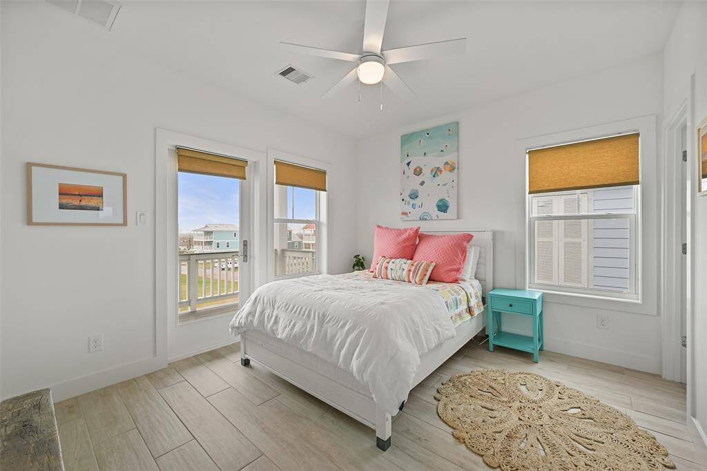 This beautiful and well appointed bedroom is ready for your guests!  The ensuite has a tub/shower combo and nice vanity.  The door leads to the east side of the house and has a great deck to watch sunsets.