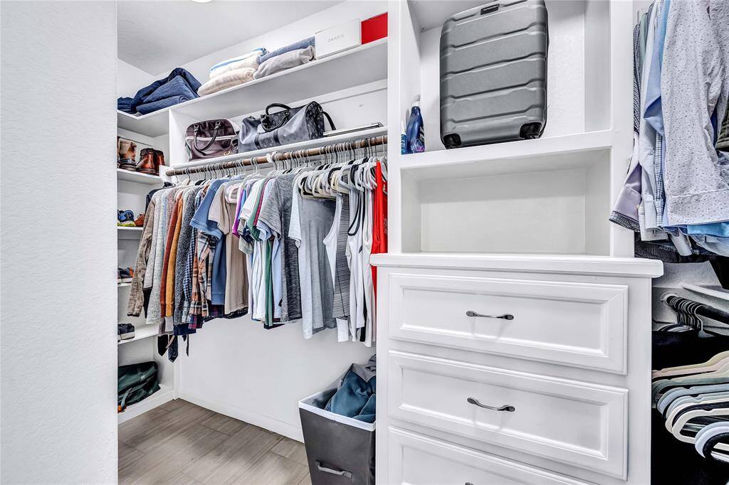 Primary walk-in closet with built-ins.