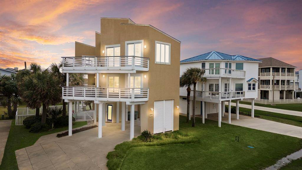 Custom home designed by David Mullican to capture perfect beach views from every room! Just steps to the beach!