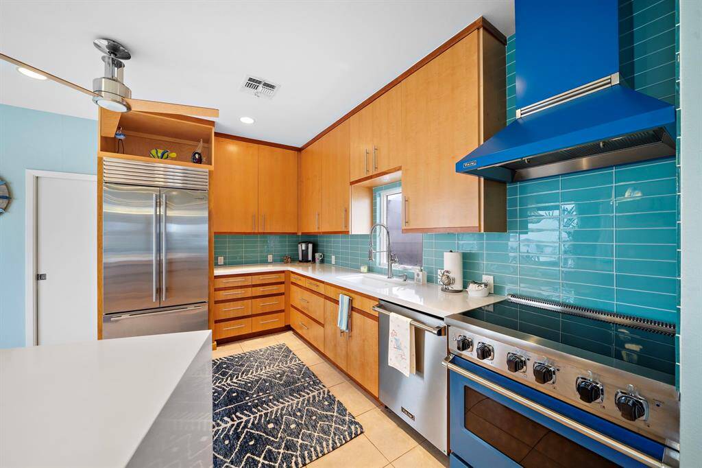 Viking range with industrial vent hood in designer blue!