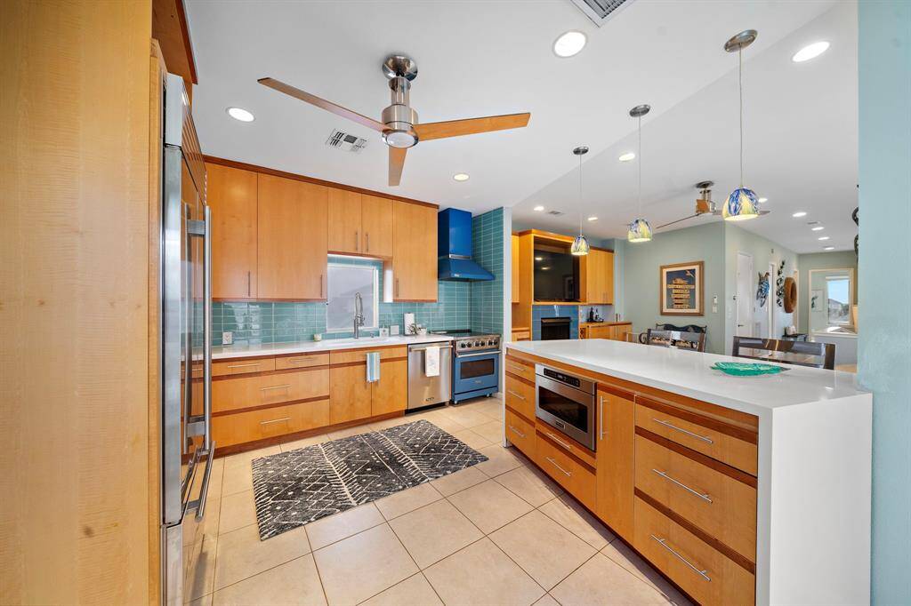 This modern kitchen offers clean lines and amazing appliances. Viking range, dishwasher and microwave drawer.