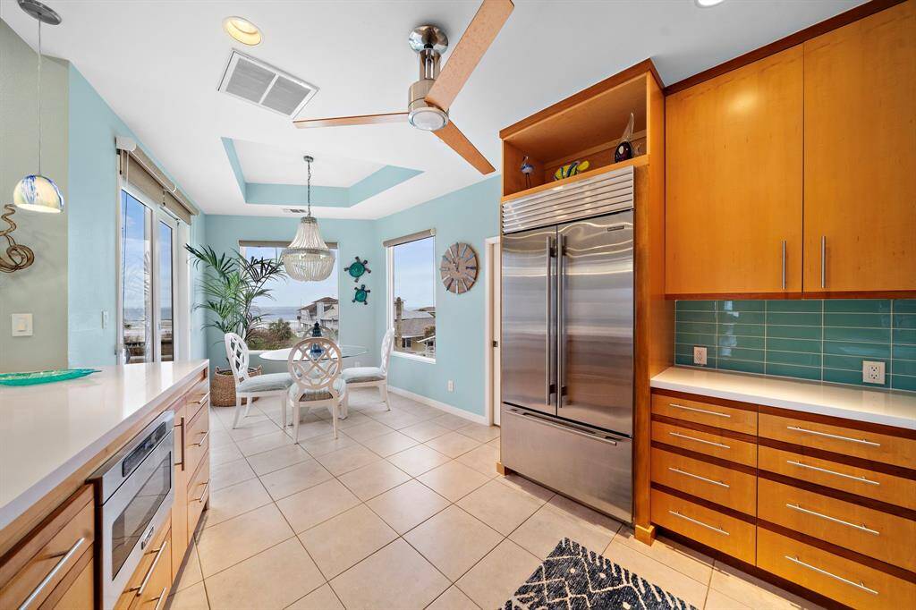 Custom cabinetry with ample drawers and storage, plus a huge walk in pantry.