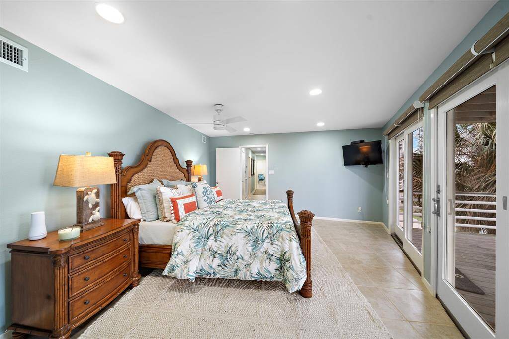 Tommy Bahama furniture and bedding for a luxurious night’s sleep. TV is excluded.