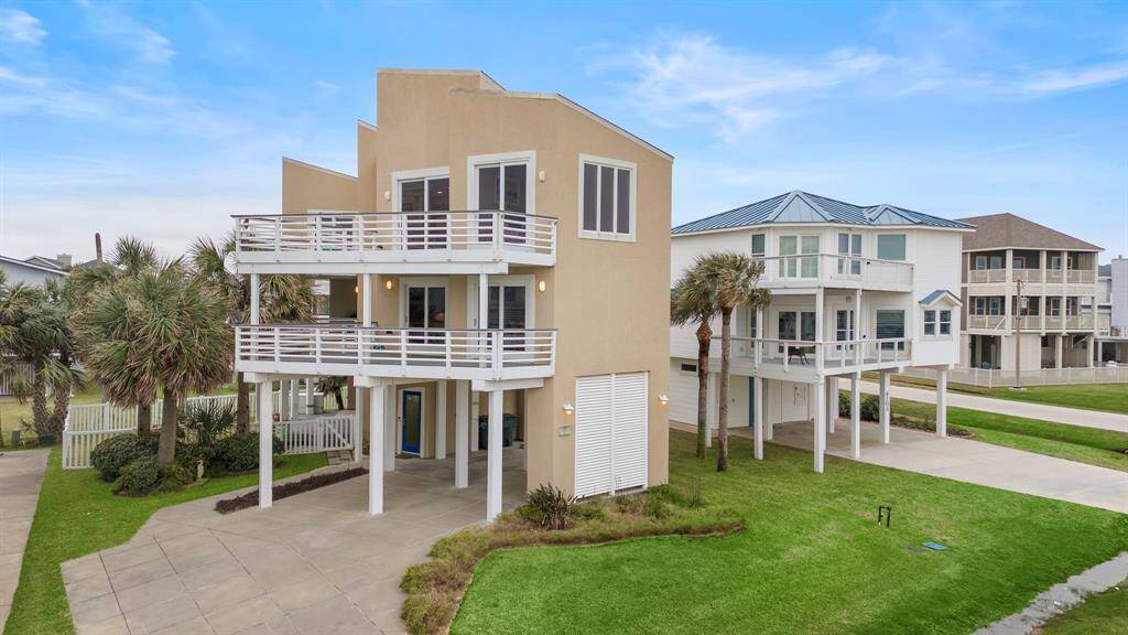 This impressive home has covered parking for at least 3 cars and more on the driveway.  First floor entry is covered for those rainy days.