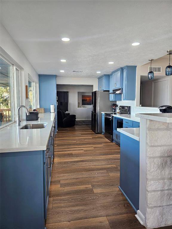 kitchen with full view of lake and pool.