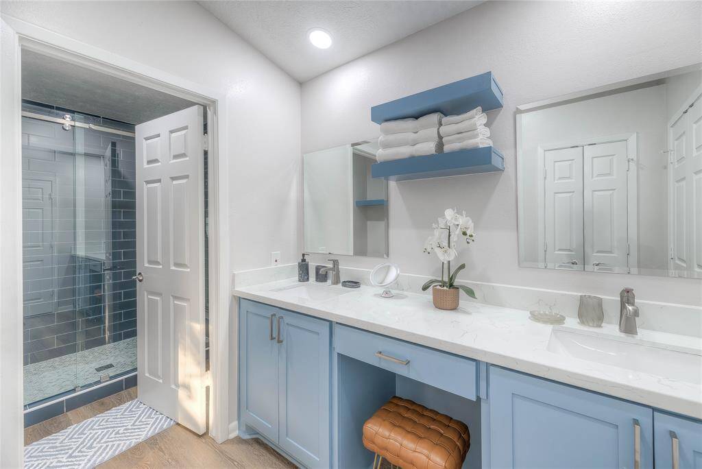 Large, En-suite bath on 2nd floor primary suite, complete with his/her sinks, quartz tops and soft-close cabinets & drawers, walk-in closet, along with a beautiful tiled extra large shower.