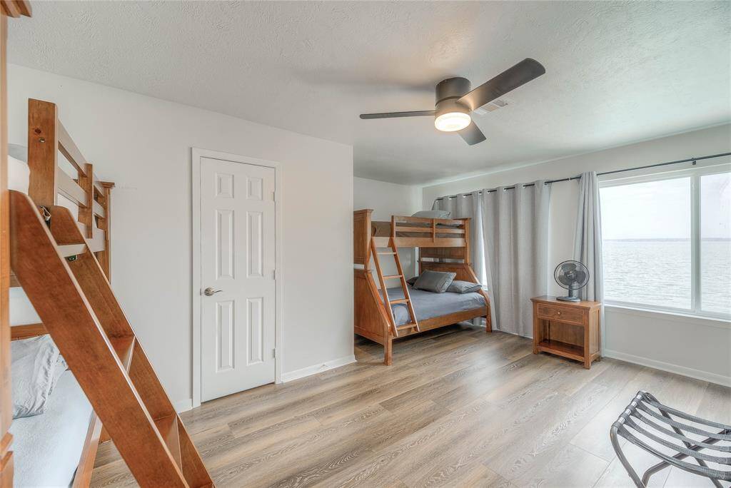 4th bedroom on second floor can sleep up to 6 and also enjoys the view of the lake and pool