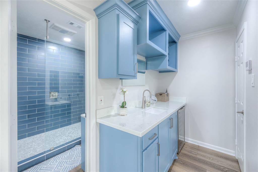 The penthouse suite boasts a beverage/wine refrigerator in the sink area.