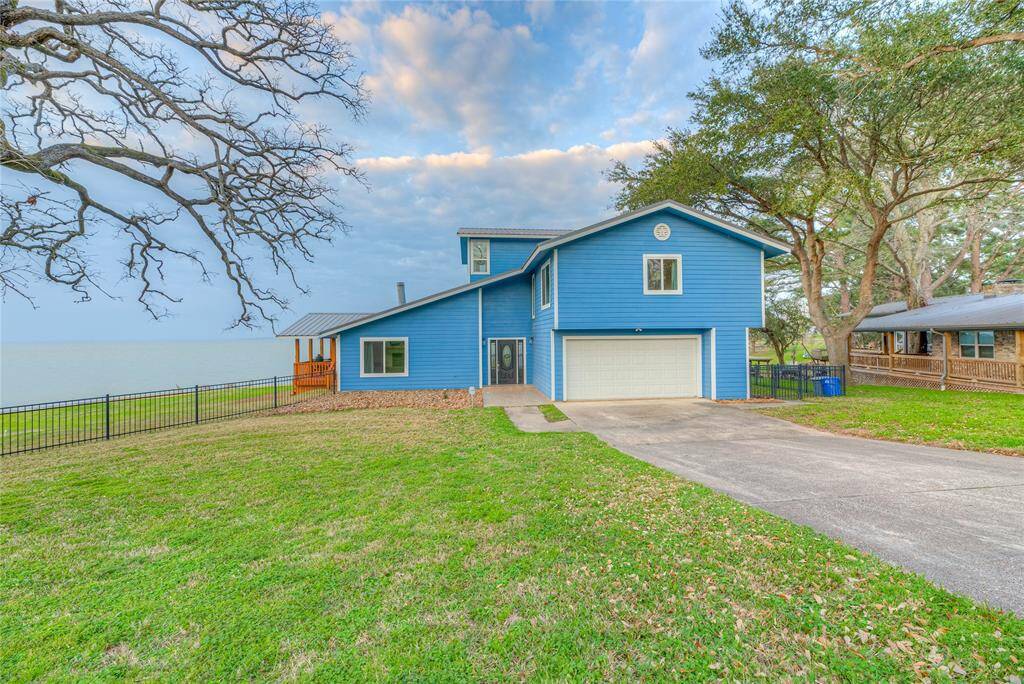 View from the street. 2 car garage with automatic garage door opener.