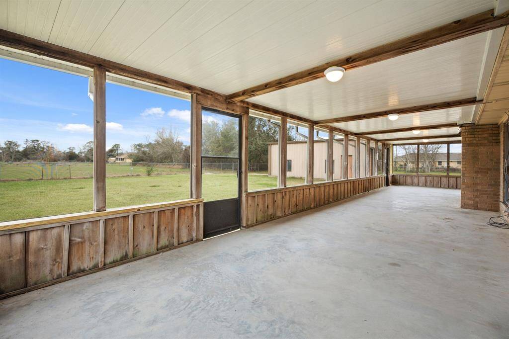 Enjoy the roomy, screened-in back porch that's covered for your comfort.