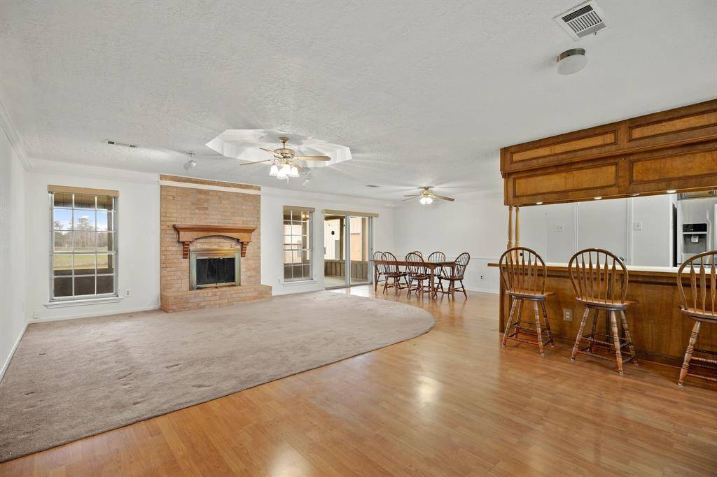 As you enter the home, you'll feel welcomed with the large family room and brick fireplace.