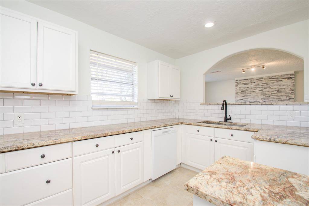 Kitchen DOES include Oven and Stove Top