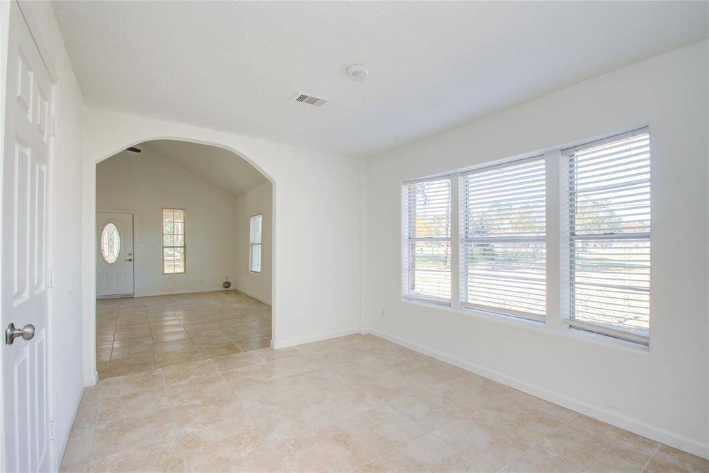 View from Dining Room into Living Room and Front Entrance.