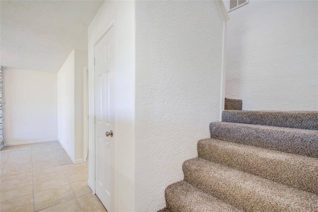 View to stairs that lead to 2 bedrooms and 1 bath upstairs.  New carpet on stairs and upstairs bedrooms.