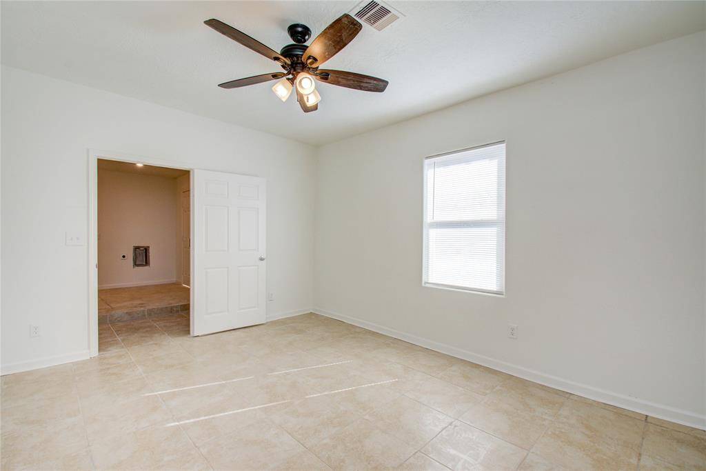 Large downstairs primary bedroom.  New tile throughout.