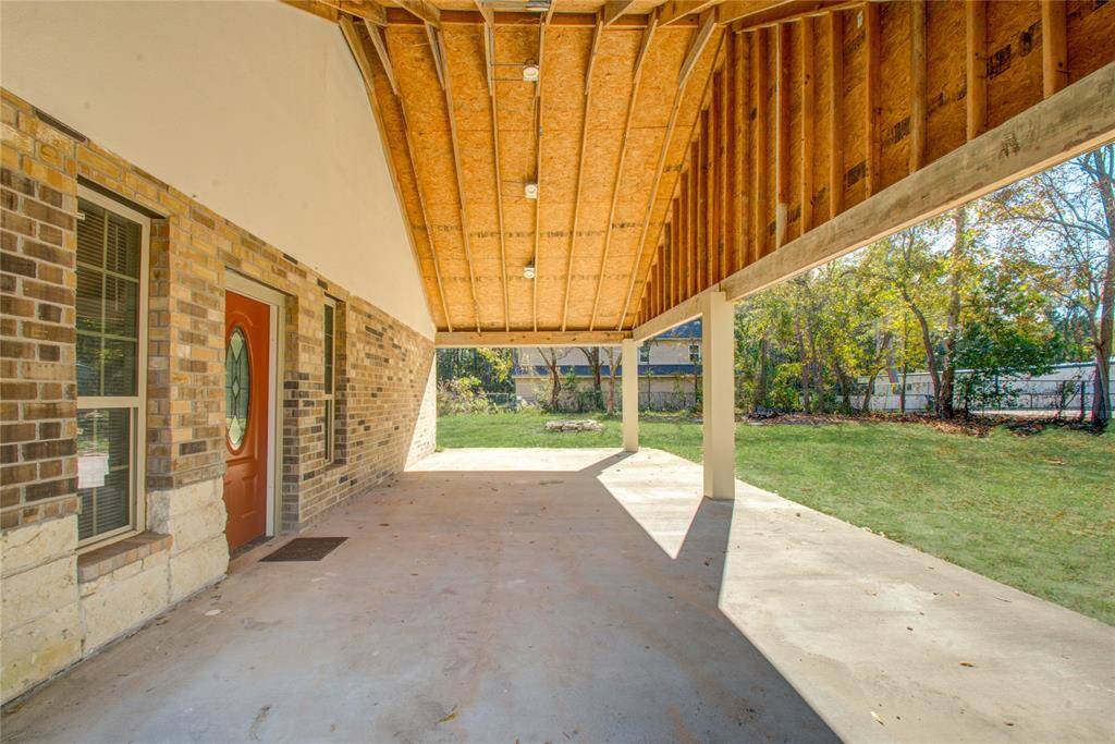 Large, covered side porch that leads with door to main living area.  Great for entertaining or relaxing.