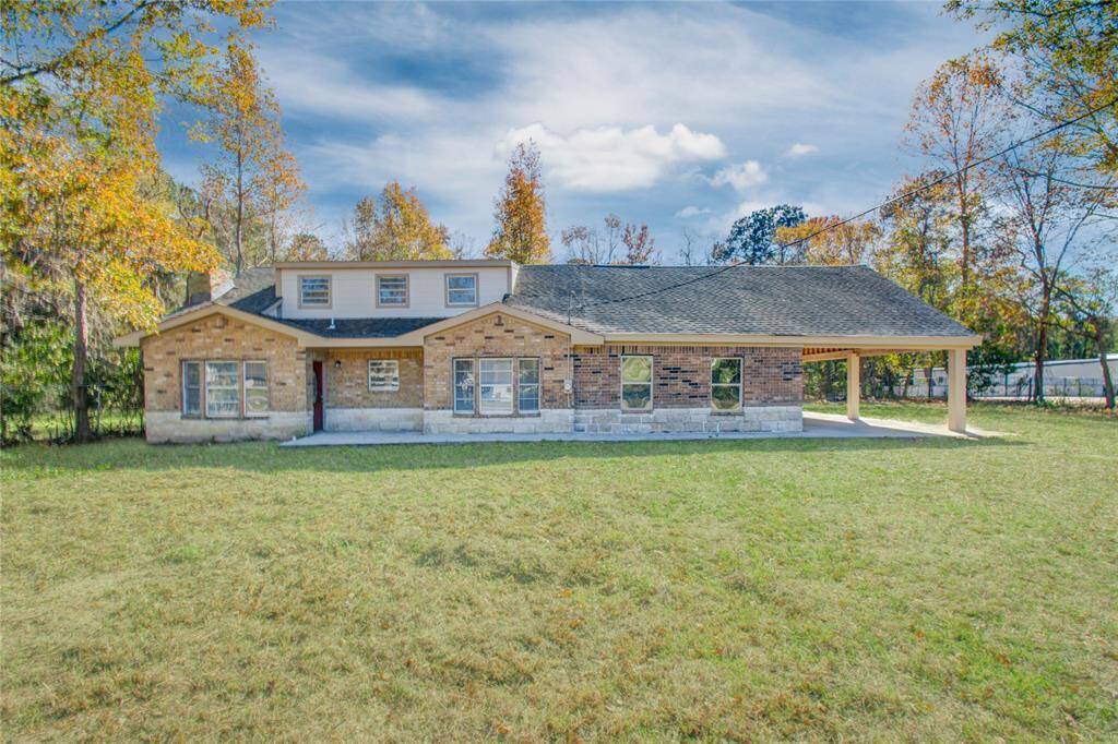 Another view of the front of the property and front yard. While there is no formal driveway, you can easily park next to your house.