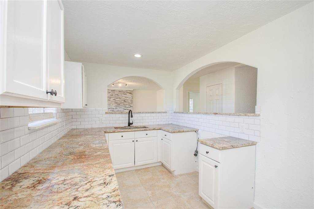 Modern granite countertops and cabinets Kitchen includes a new oven and electric stove top (not currently pictured here).