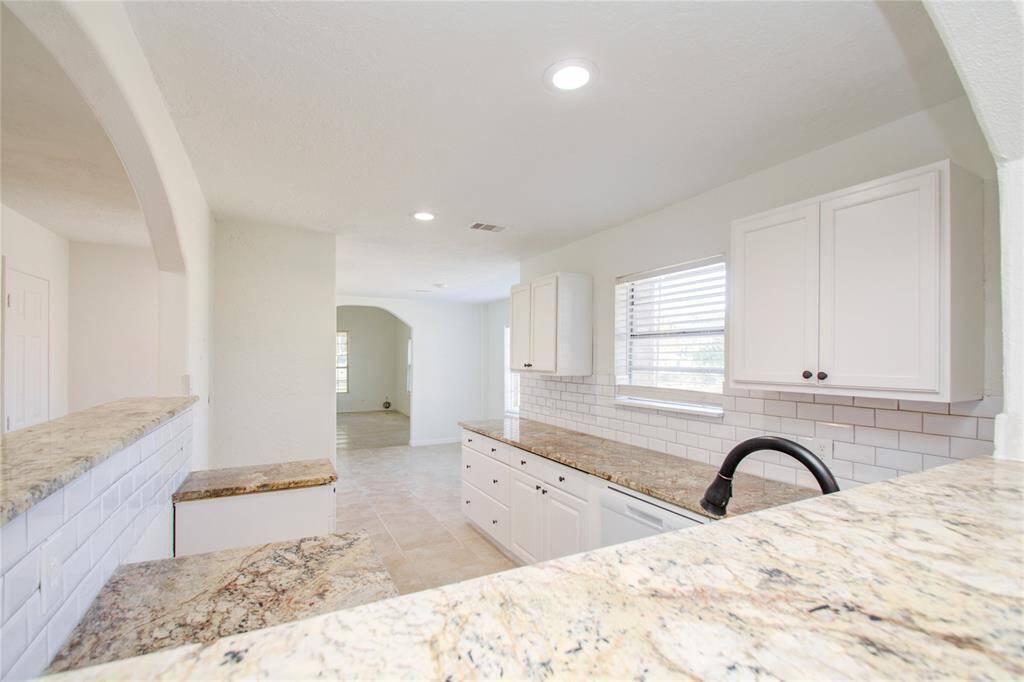 Modern countertops and cabinets.  Kitchen DOES include Oven and Stove Top