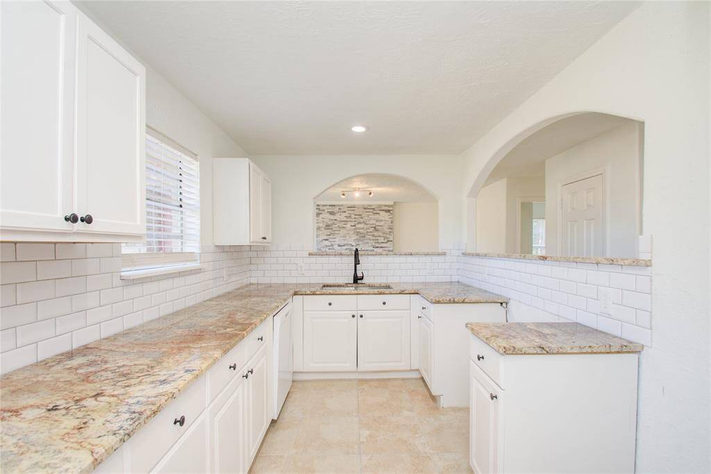 Kitchen DOES include Oven and Stove Top
