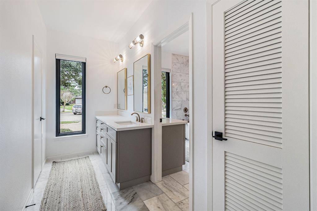 The primary bathroom enjoys two separate vanity areas for yet more peace and quiet on busy mornings.