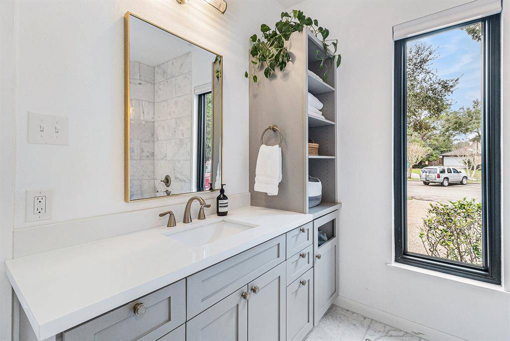 The second vanity area with yet more storage in custom cabinets.