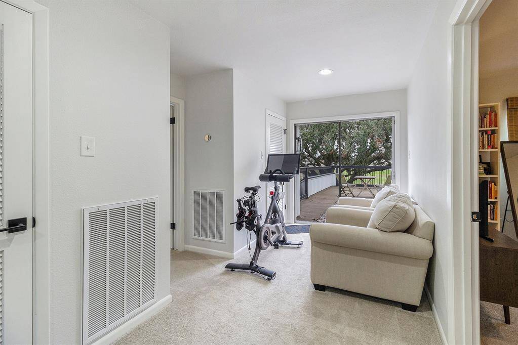 This useful space gives access to the second floor patio for even better views of the golf course.
