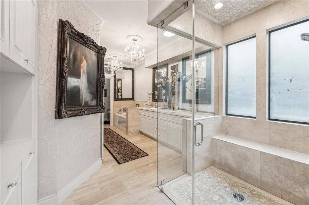 PRIMARY BATHROOM- Wheelchair accessible, steam shower and soaking tub.