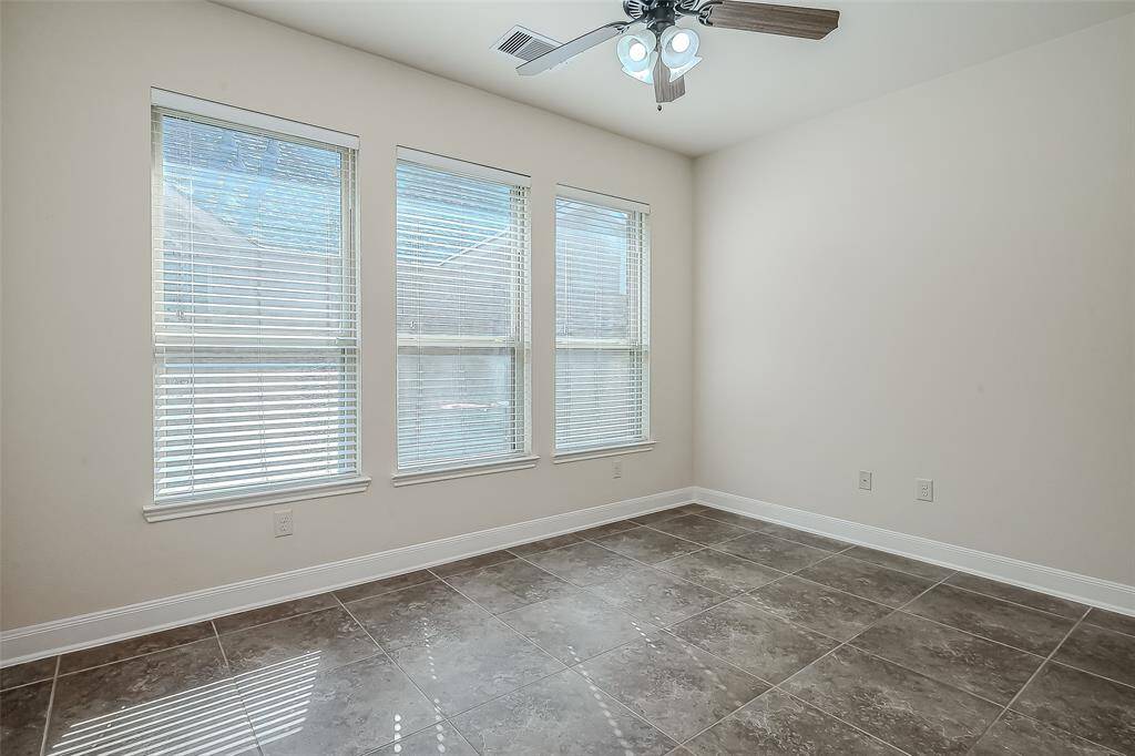 Extra room off kitchen can be used as a sunroom, media room, playroom, or extra guest room