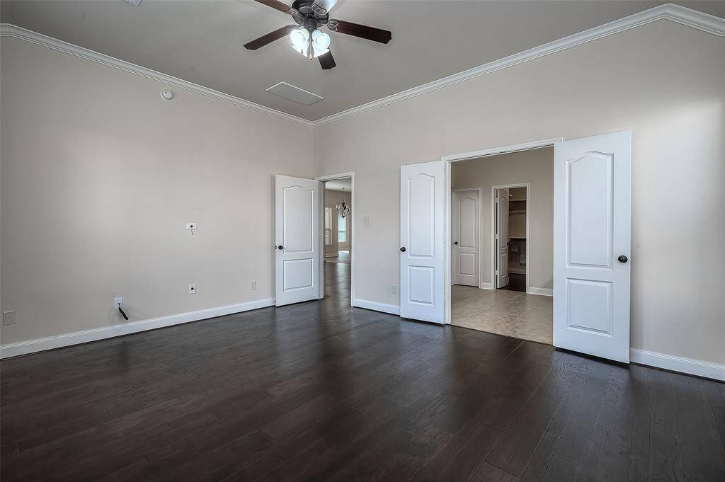 Primary suite offers crown molding detail