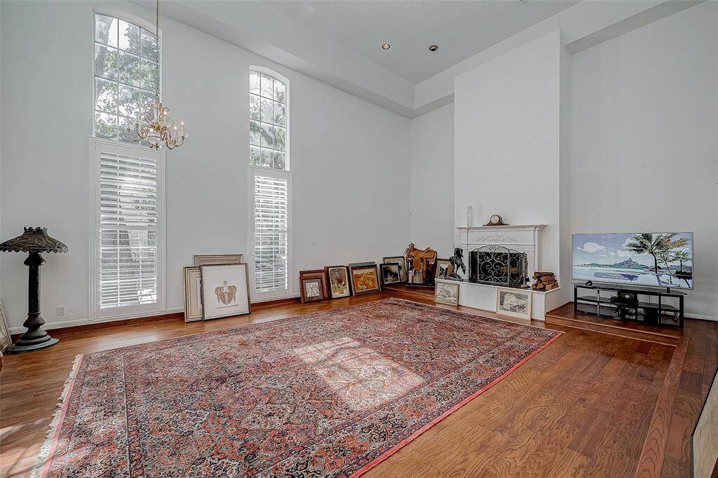 Beautiful 22' windows, hardwoods and a wood-burning fireplace in the living area