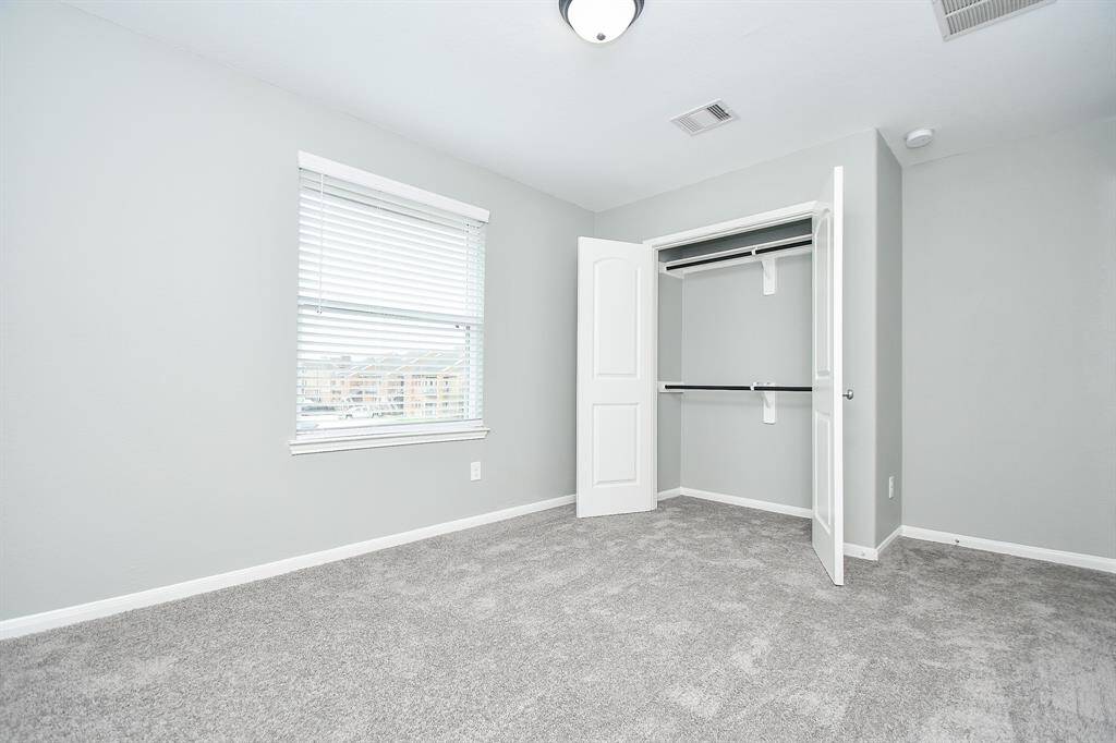 Another view of the fourth bedroom.