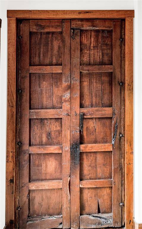 Rich artistic pantry doors...handcrafted with Antique Mexican Mesquite wood