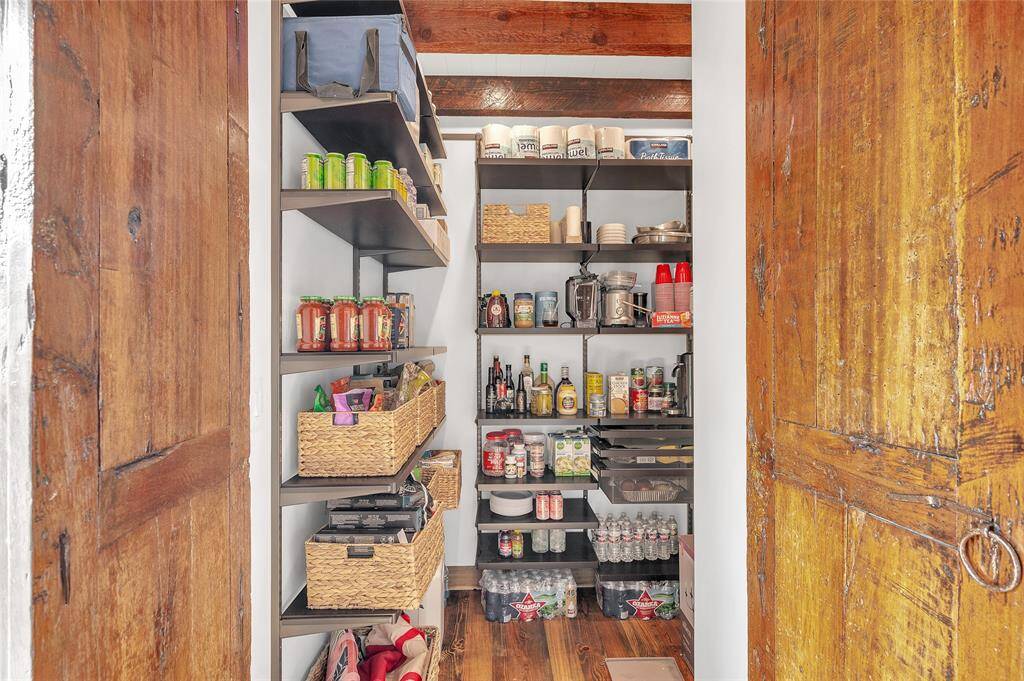 Walk-in custom Elfa pantry with more than ample space for organized storage