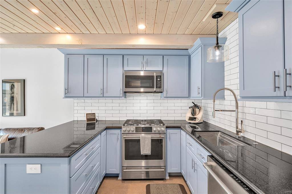 As you enter the guest house, you'll find a full kitchen with granite counter tops, custom made cabinets, "Cafe" appliances and an AXOR Citterio faucet.  Large pantry & storage closet not shown