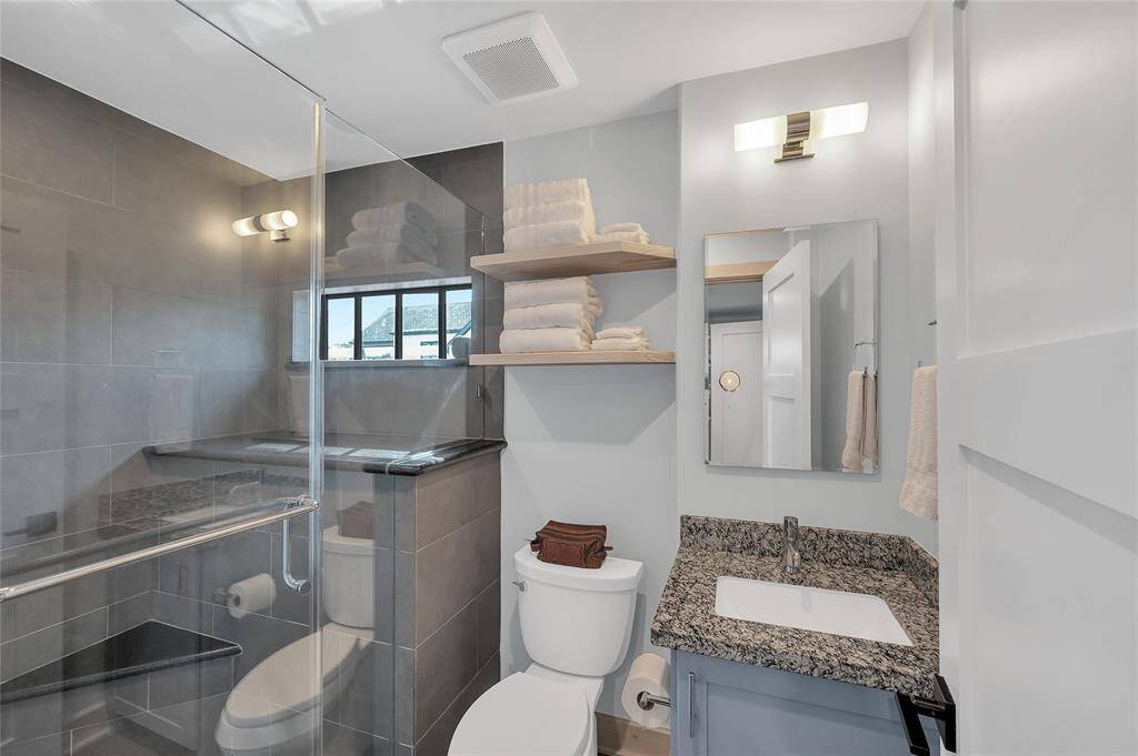 One of 2 full baths in the guest house with a walk in shower