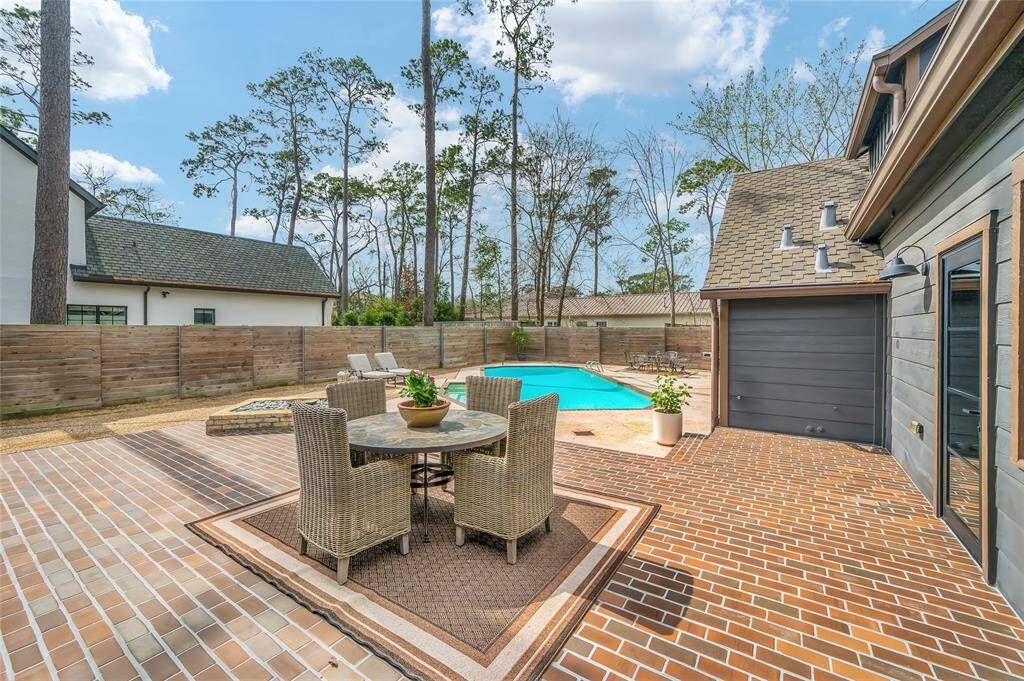 Wow! Welcome to your backyard oasis.  This unique patio features custom laid fired italian terracotta tiles