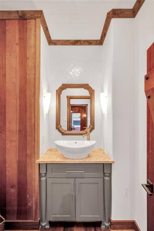 The powder room has elegant Glazed Italian tile, & located off of the dining room