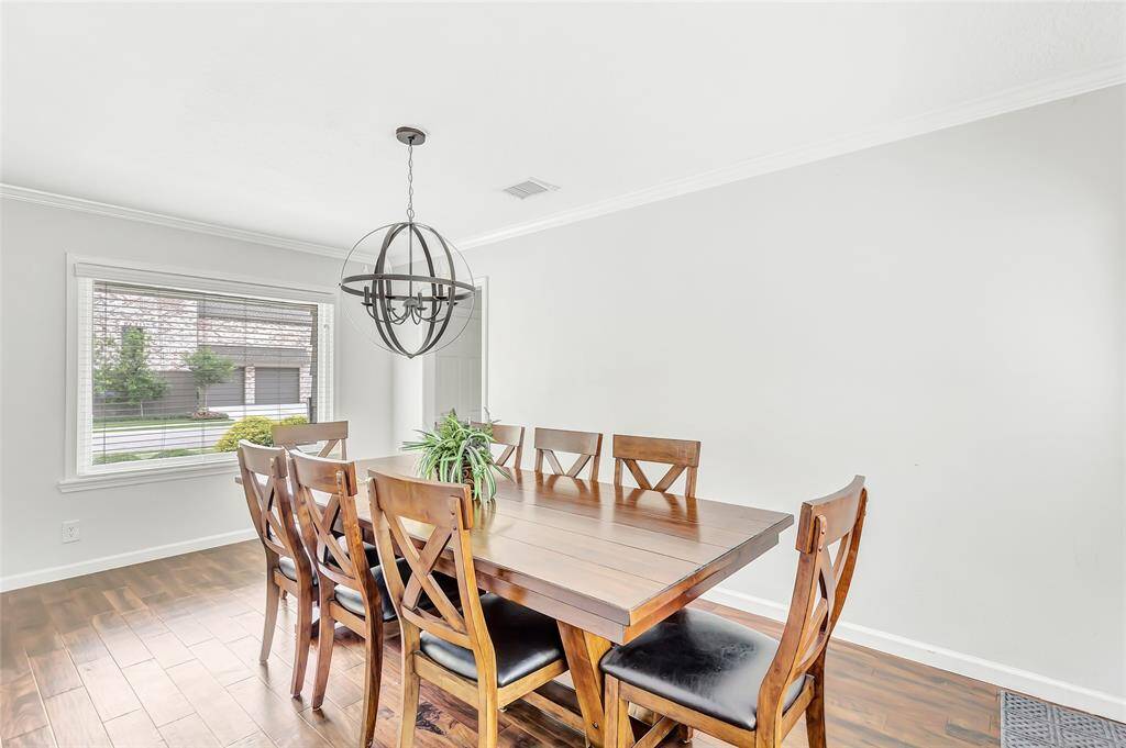 The dining room overlooks the front and back yards.