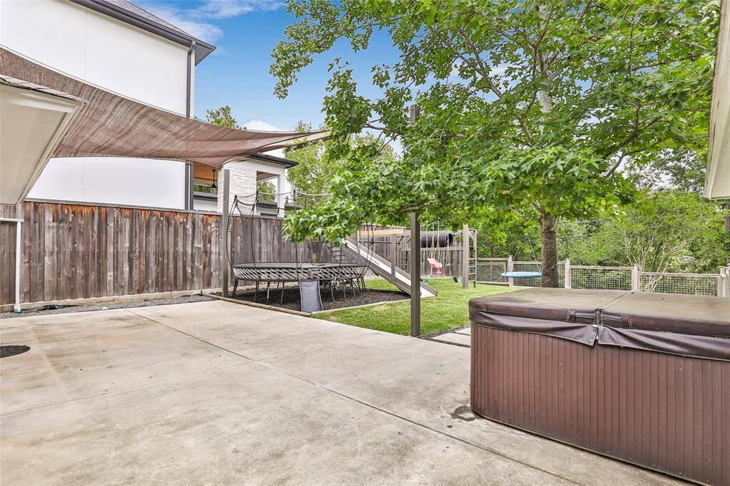 Back patio with a hot tub
