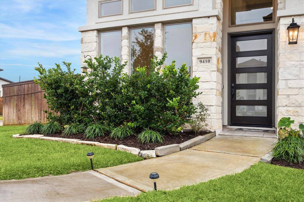 An inviting, modern glass-paneled front door sets the tone for this stylish and sophisticated home. This fabulous home is loaded with upgrades!