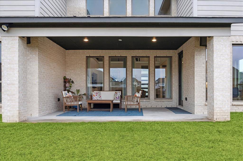 The large covered patio, another thoughtful upgrade, provides the perfect space for outdoor relaxation and entertaining.