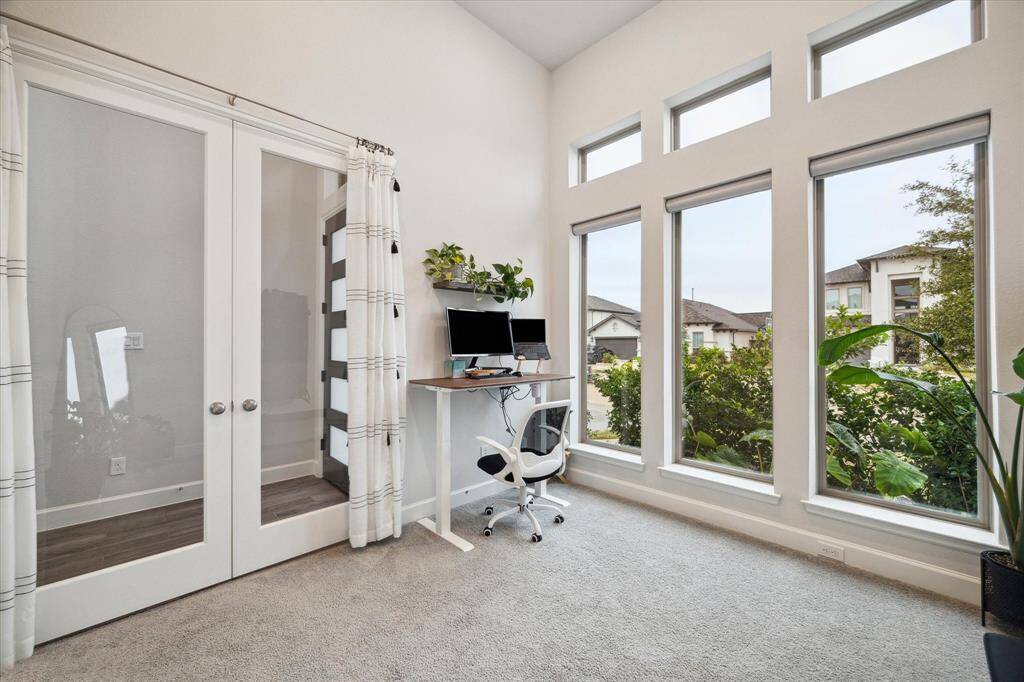 The high ceilings make the private home office feel very spacious.  It has French doors, and light filtering shades. They are convenient and very easy to adjust, depending on the sunlight or your privacy needs.