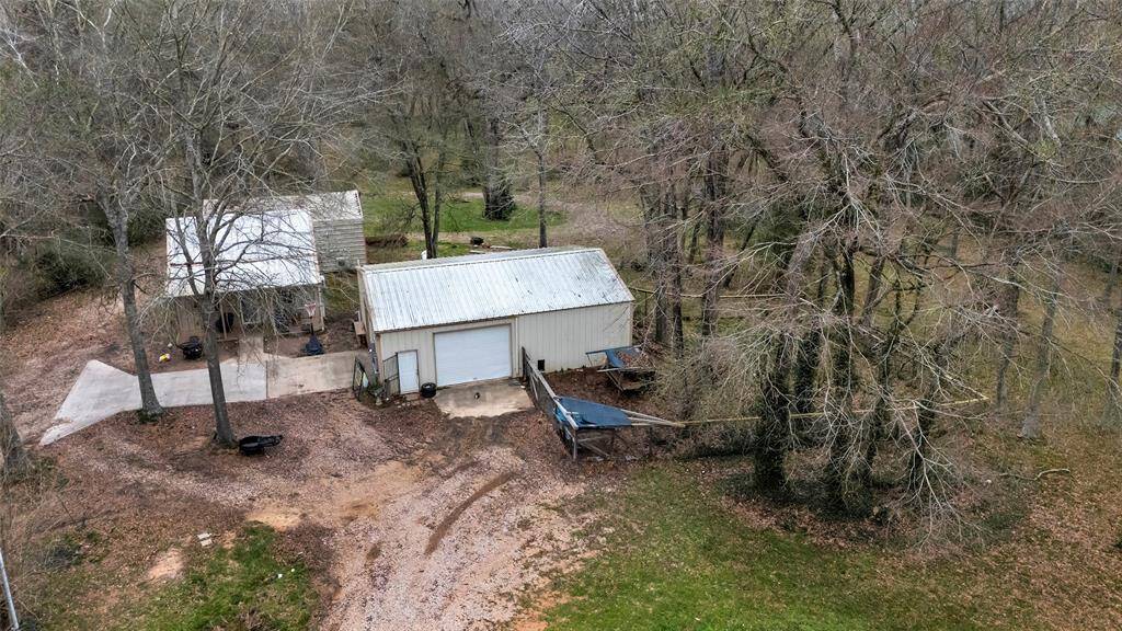 Two barns/storage buildings and 572 sq ft residence