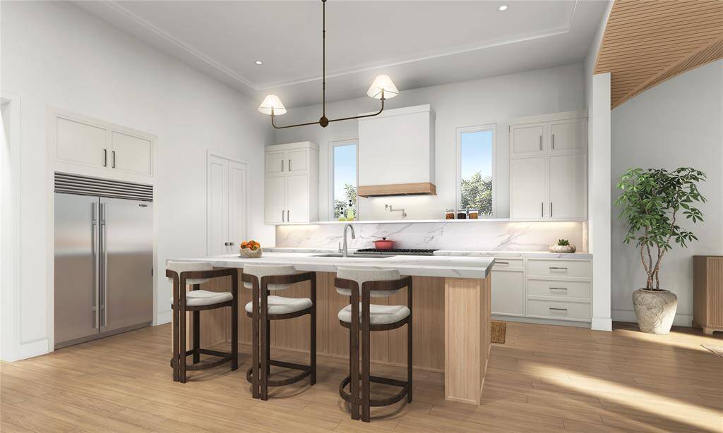 The heart of the home, this open and inviting kitchen boasts plenty of counter space, storage, and room for culinary creativity. Ideal for cooking or casual entertaining, its modern design effortlessly blends functionality and style to elevate every meal preparation.