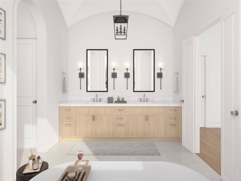 An expansive primary bathroom that offers spa-like relaxation. The generous layout accommodates dual vanities, a soaking tub, and a walk-in shower. With premium finishes and thoughtful design, this is the ultimate retreat for unwinding after a long day.