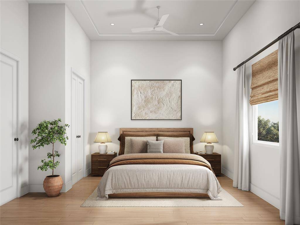 A bright and airy bedroom perfect for family or guests. With enough room for a bed, desk, or additional furniture, this versatile space caters to comfort and style. Its design ensures restful nights for all.